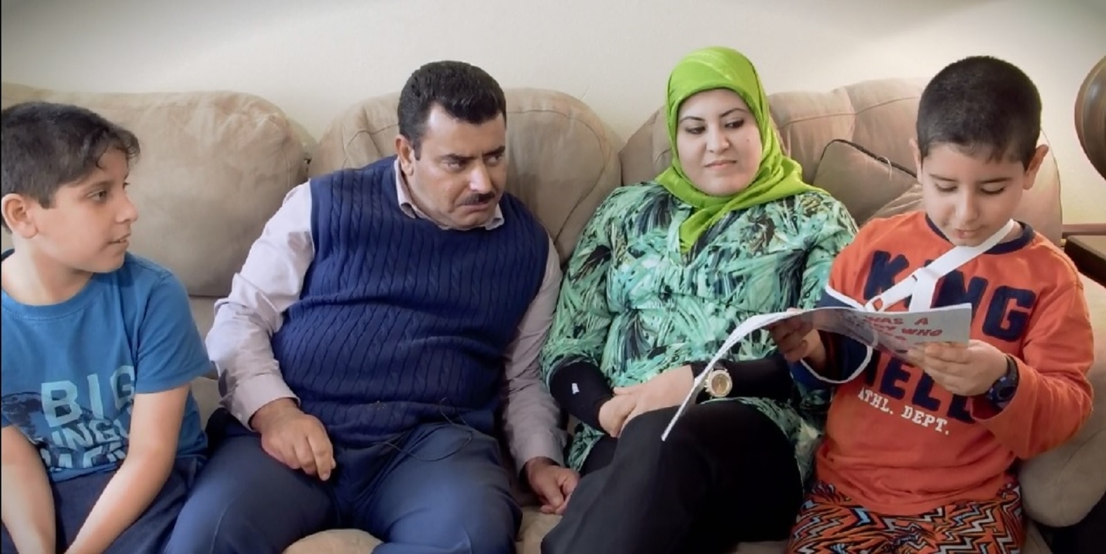 Ihssan at home with his family